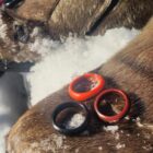 Yukon plastics ring on top of a fair snow boots surrounded by snow